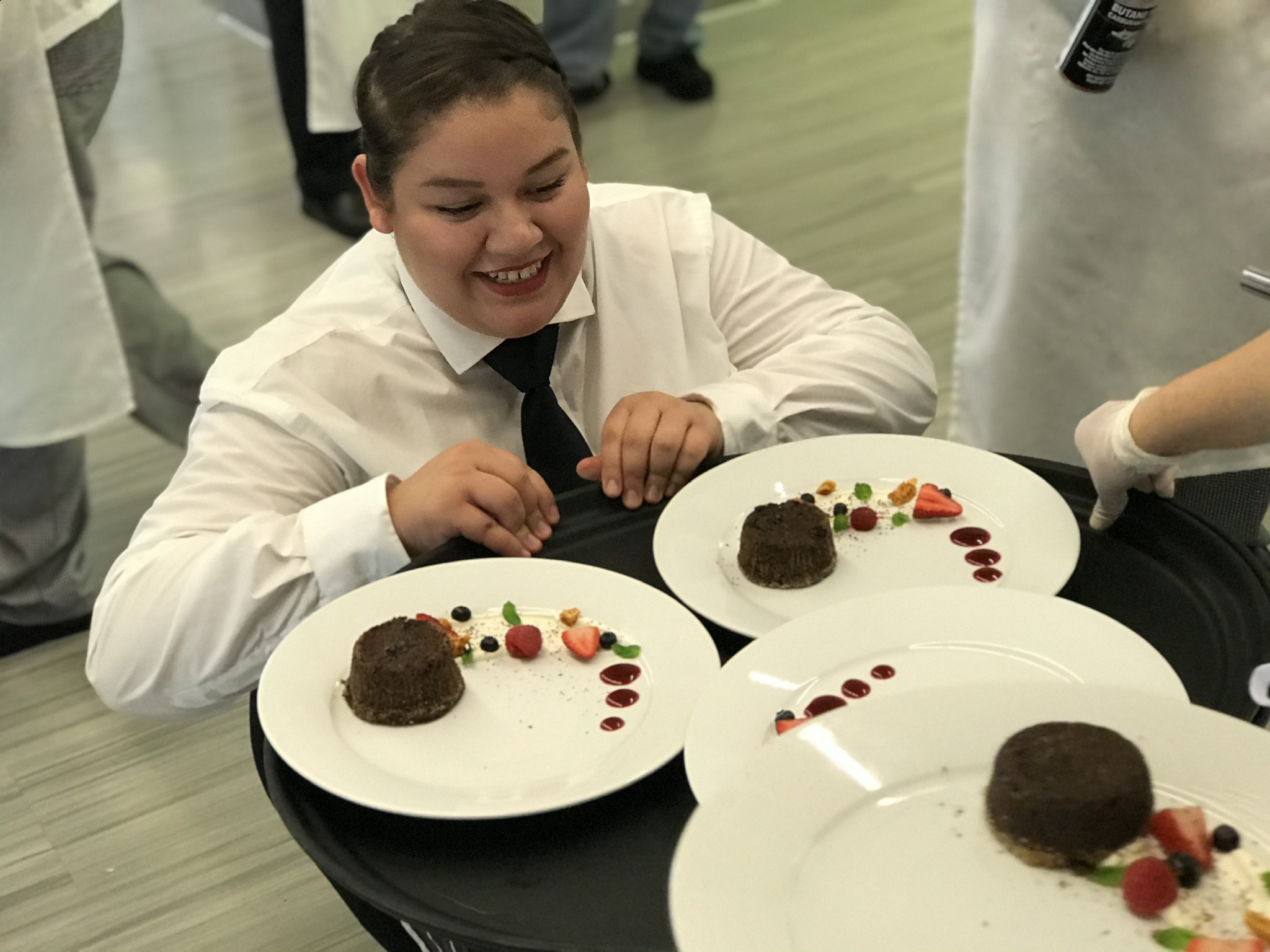 Student Introducing Her Desserts