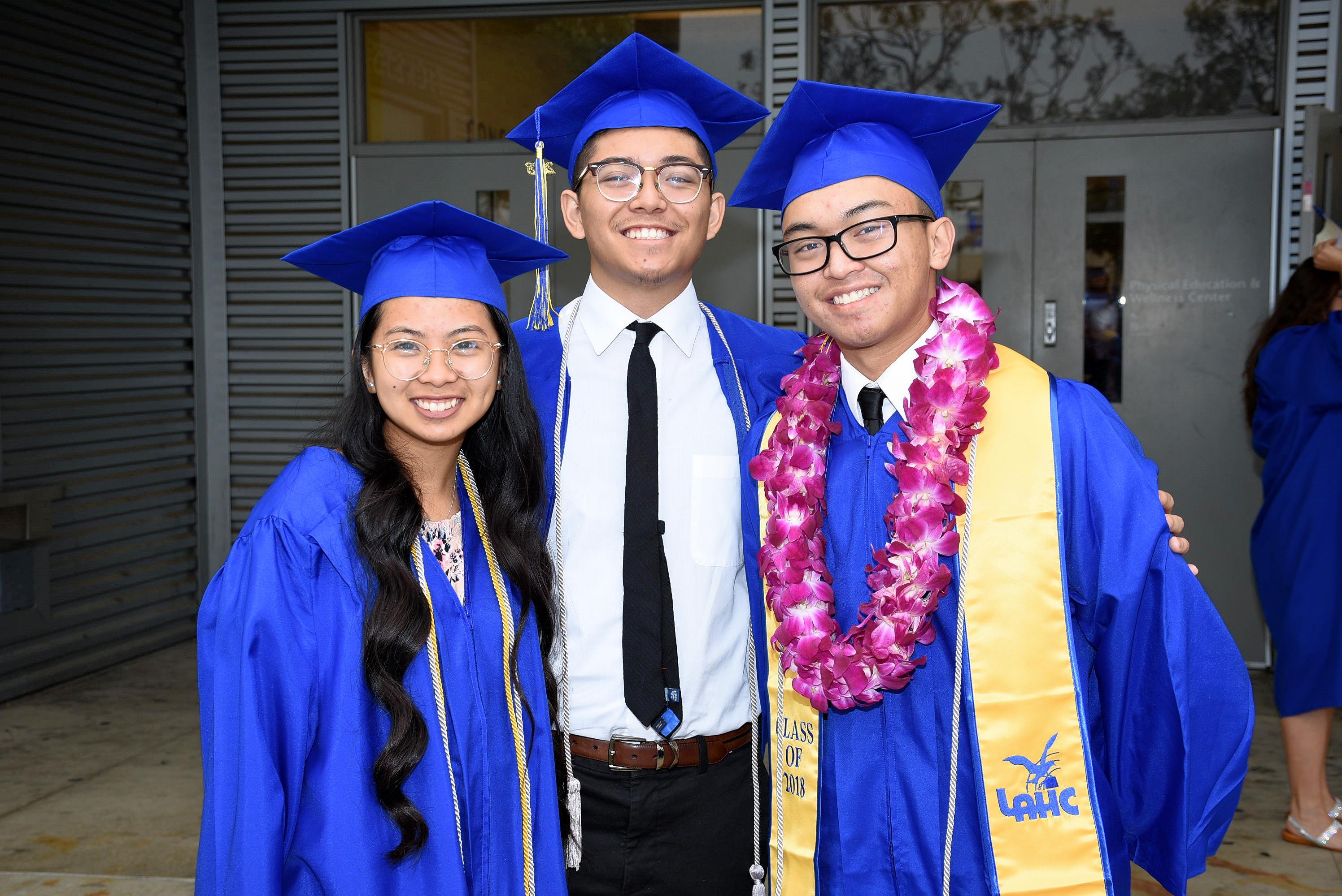 Three Graduated Students Smiling