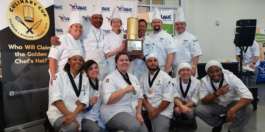 Winners of the Culinary Cup Raising the Golden Chef Hat