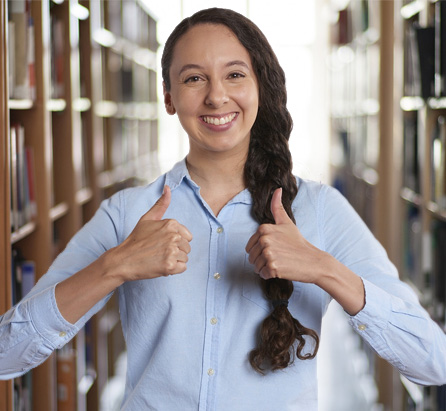 Student Smiling with Thumbs Up