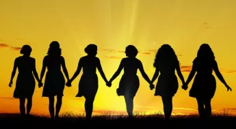 Women holding hands