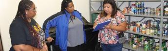 Three Women inside a Food Pantry